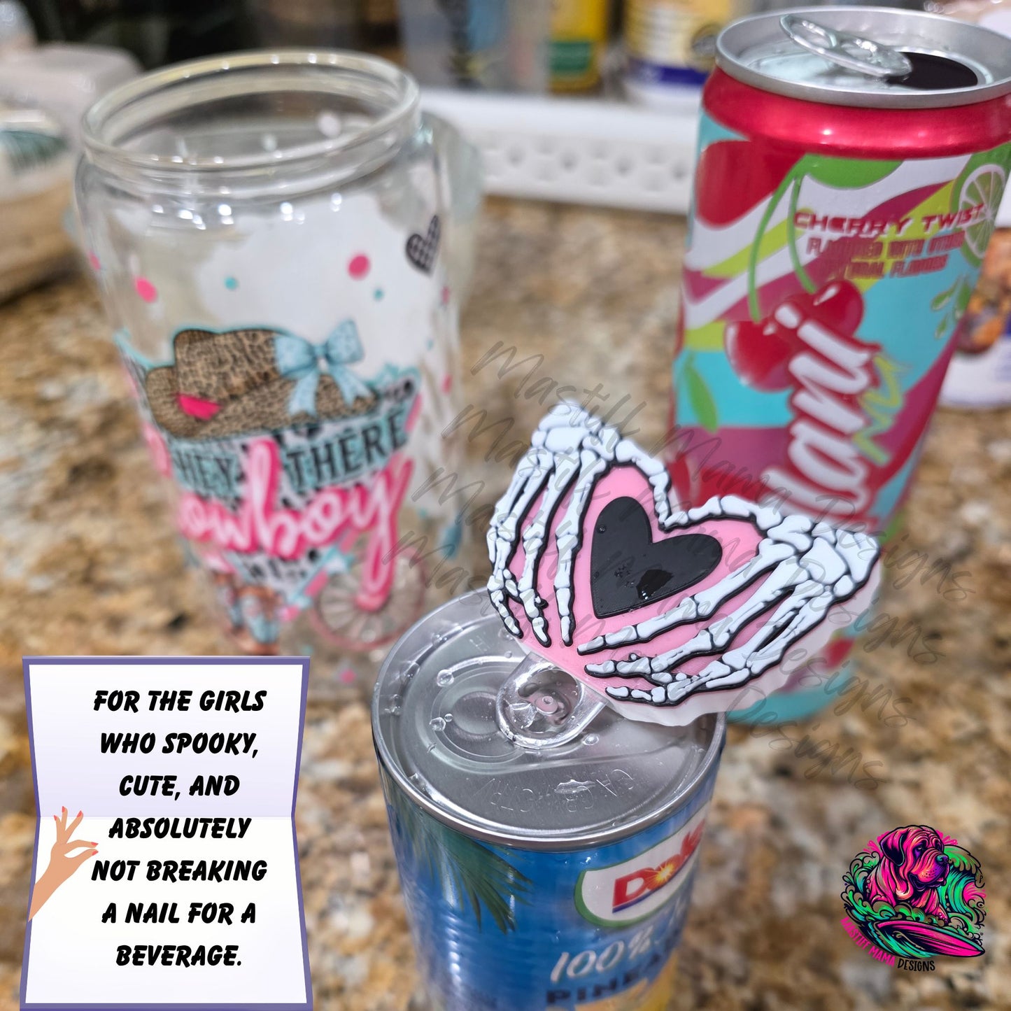 Close-up of spooky skeleton hand heart can tab opener, 3D printed nail saver tool for opening soda, energy drinks, and sparkling water cans.